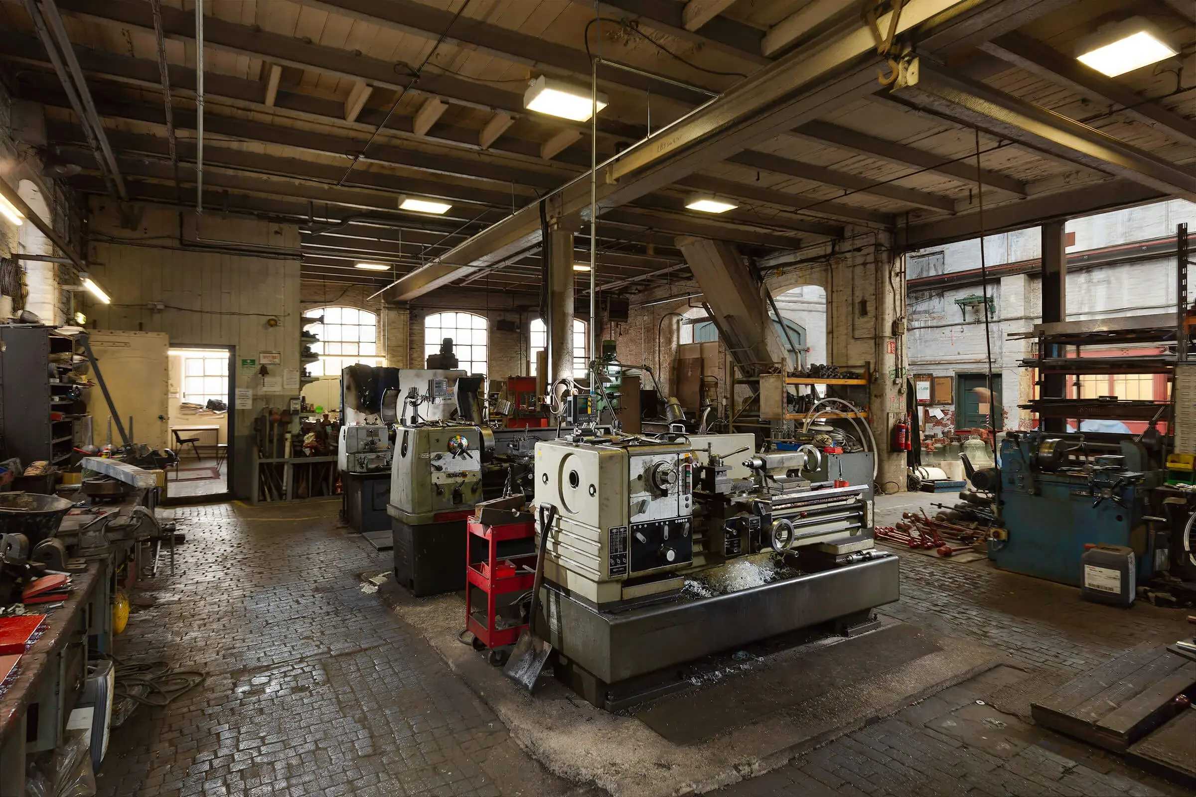 John Taylor and Co. Machinist floor. After casting the small bells are turned and tuned in regular metal lathes.
